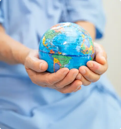 a girl holding a globe