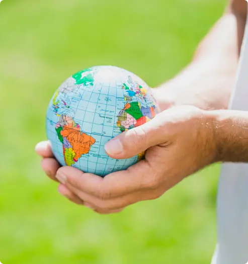 a girl holding a globe