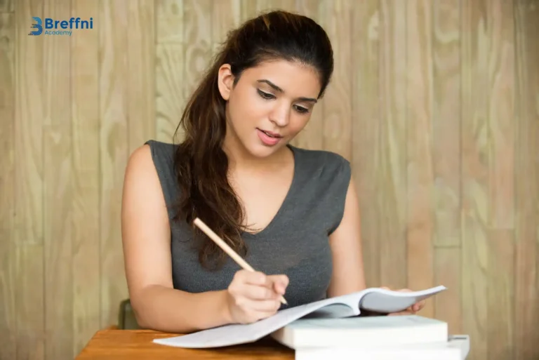 A focused student practicing for the IELTS speaking cue card task