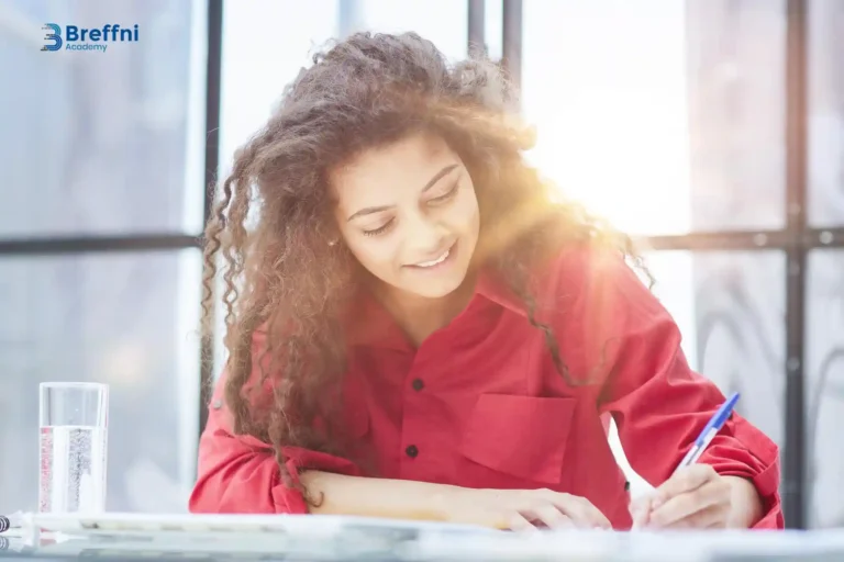 Smiling woman practicing to avoid OET writing mistakes