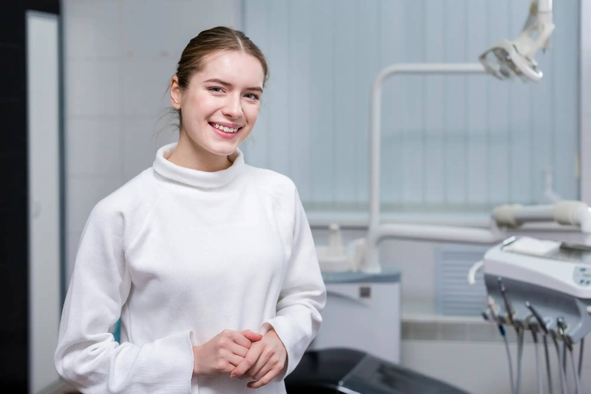 Smiling female dentist in a clinic, preparing for the OET for Dentists exam